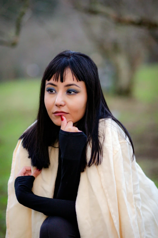 a woman dressed in a white and black costume