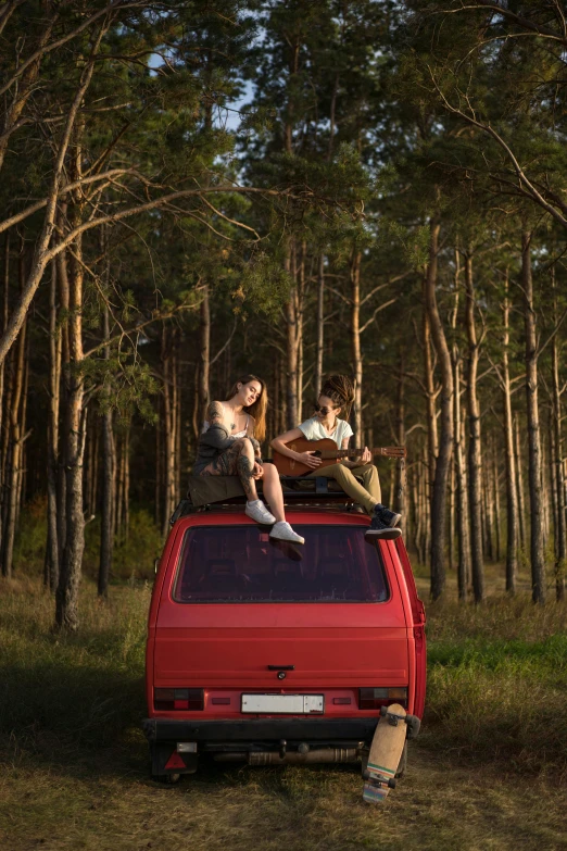 some people are riding in a van with trees