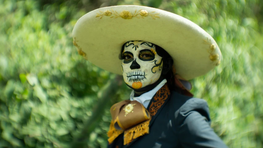 a costumed mexican skull is seen on display