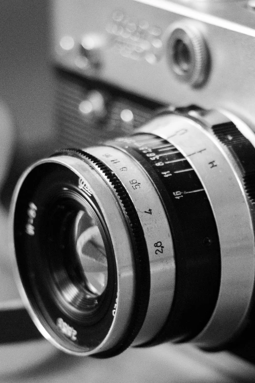 a black and white s of a camera with its lens pointed up