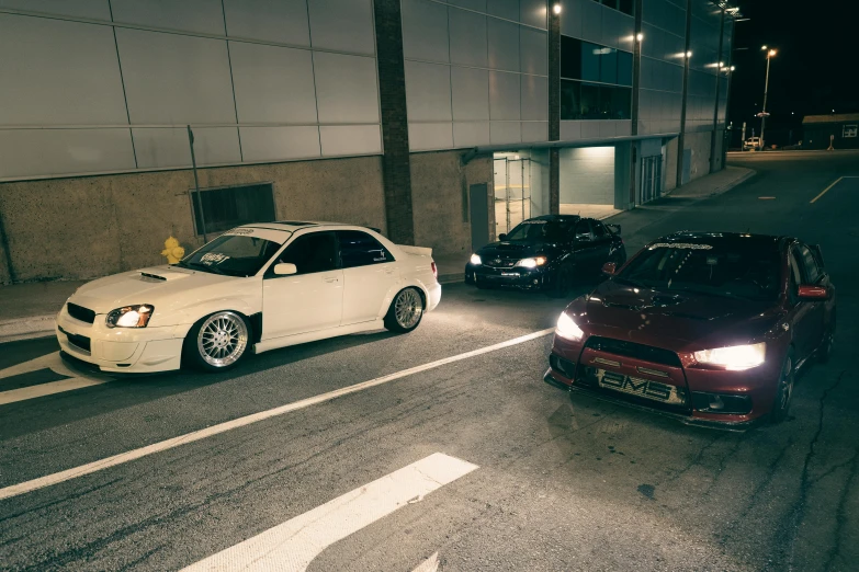 cars parked along a road during the night time