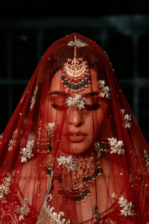 a red veil on a model's face