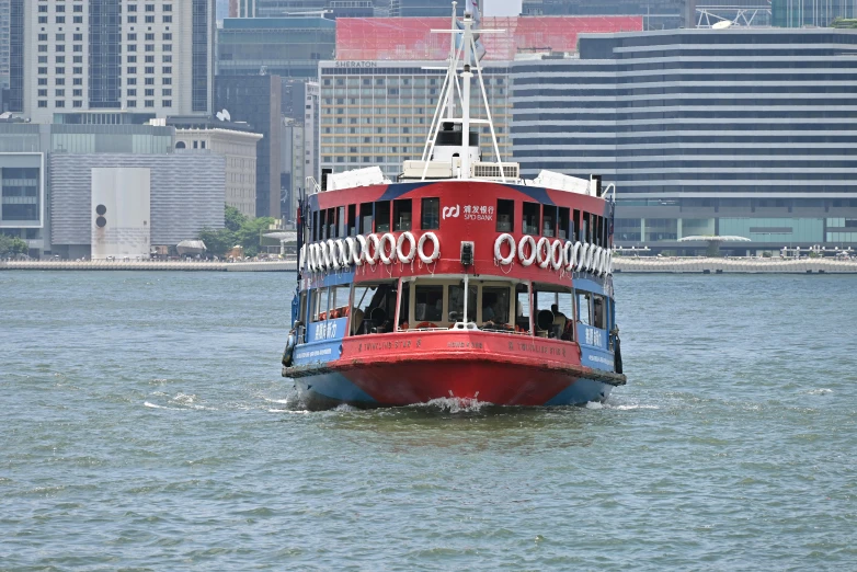 there is a red and white boat out in the water