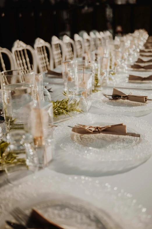 a banquet table has an elegant set centerpiece