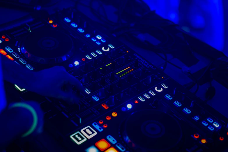 a dj mixing a music at the nightclub