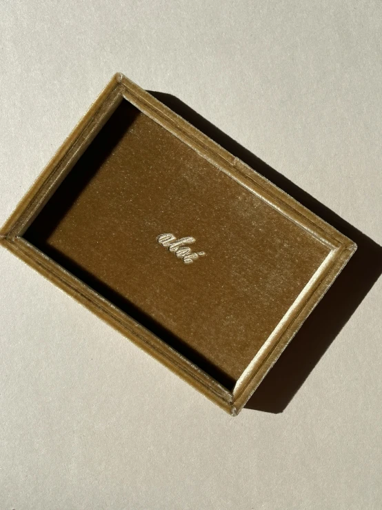 a brown box sitting on top of a white table