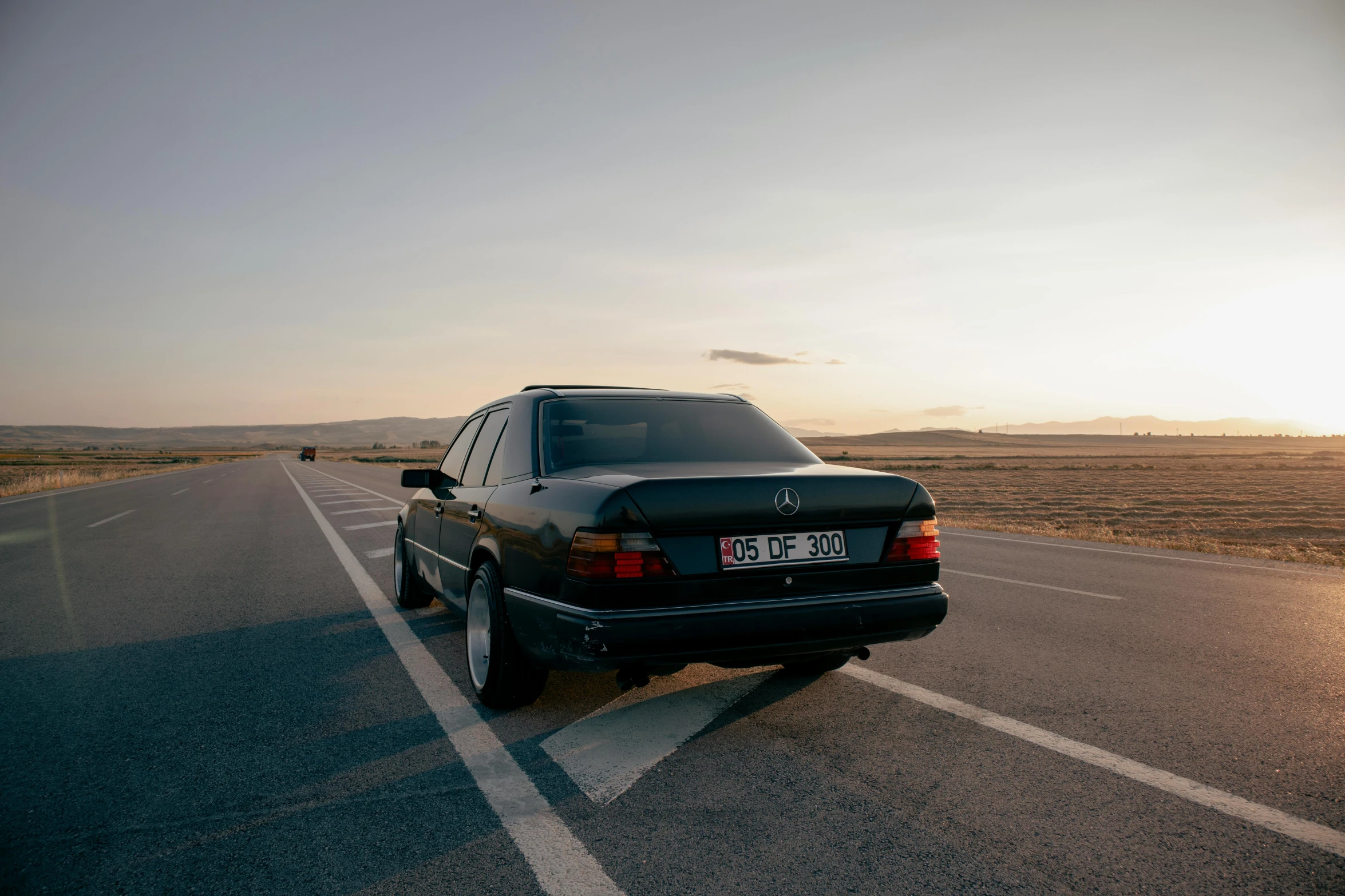 a car is shown parked on the side of a road