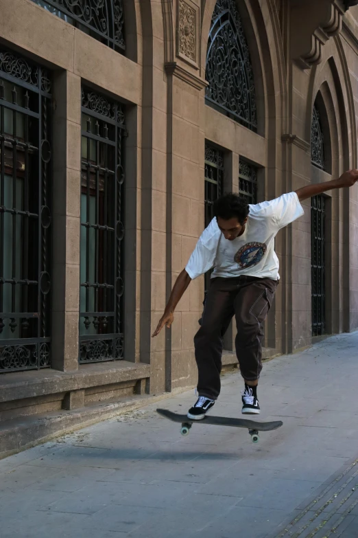 young man on a skateboard in front of a building