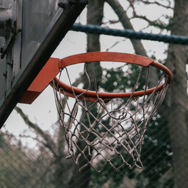 a basketball hoop with an orange plastic rim