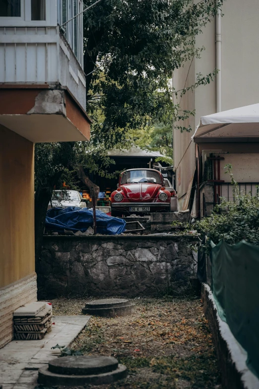 a small courtyard with cars parked on it