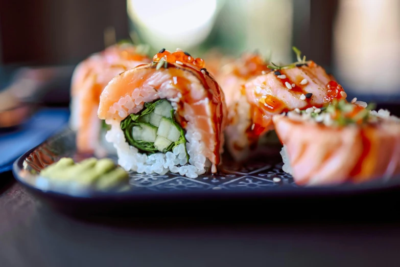 the sushi with vegetables and salmon is served on a plate