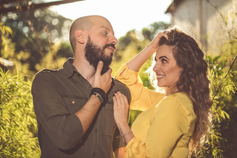 a man helping a woman with her hair