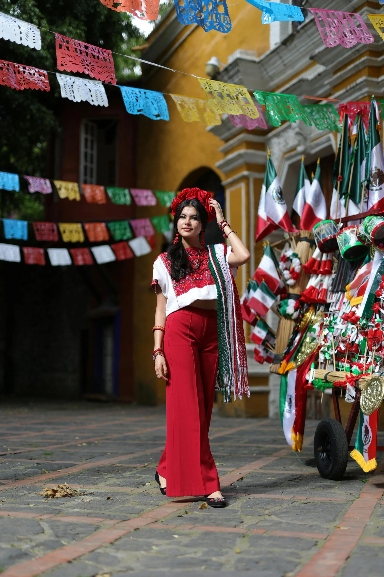 a woman standing in front of a colorful decoration