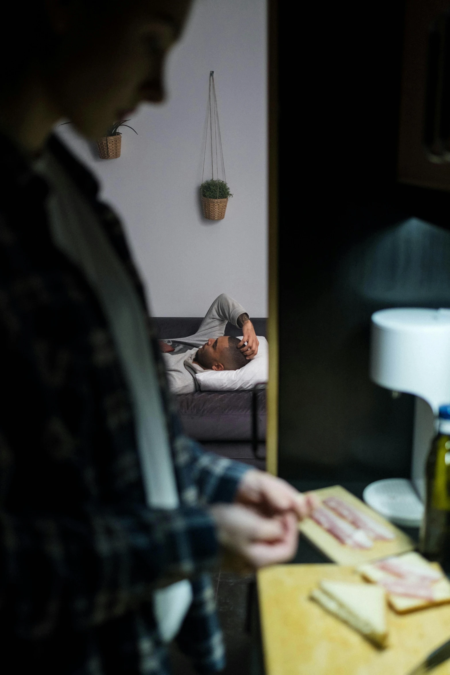 someone using the phone to take a picture in a bedroom