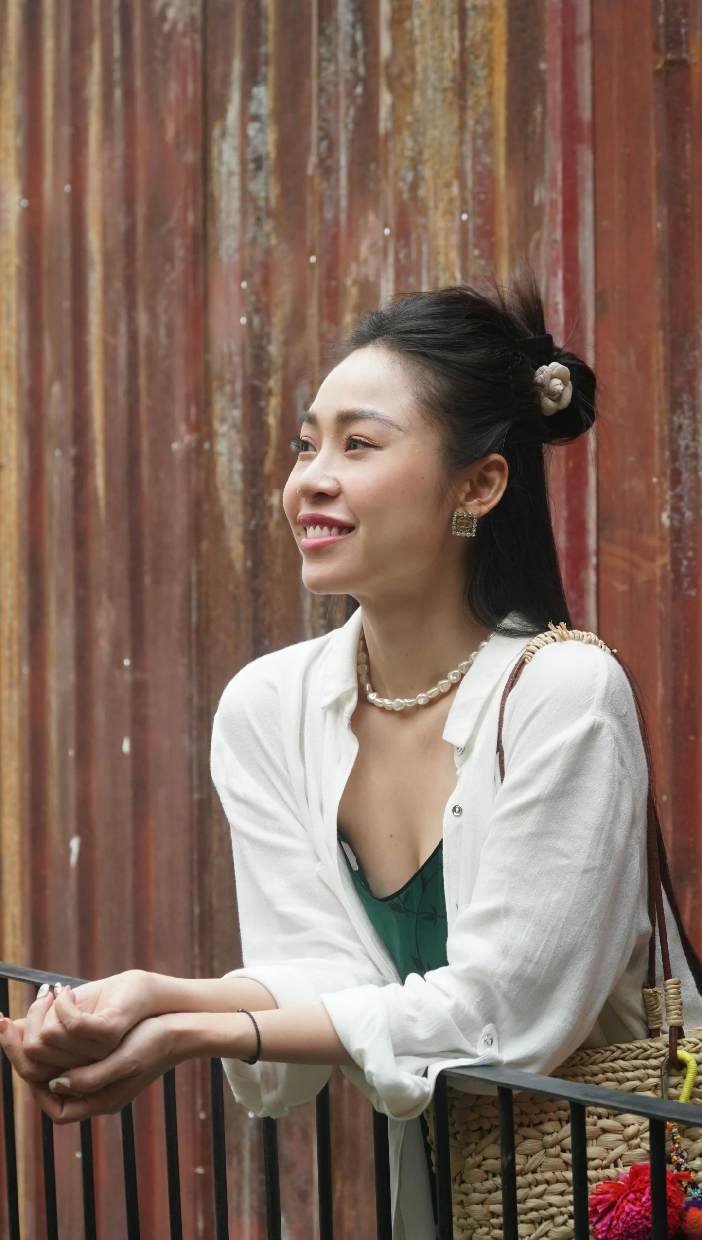 a young woman smiling with a basket on her shoulders