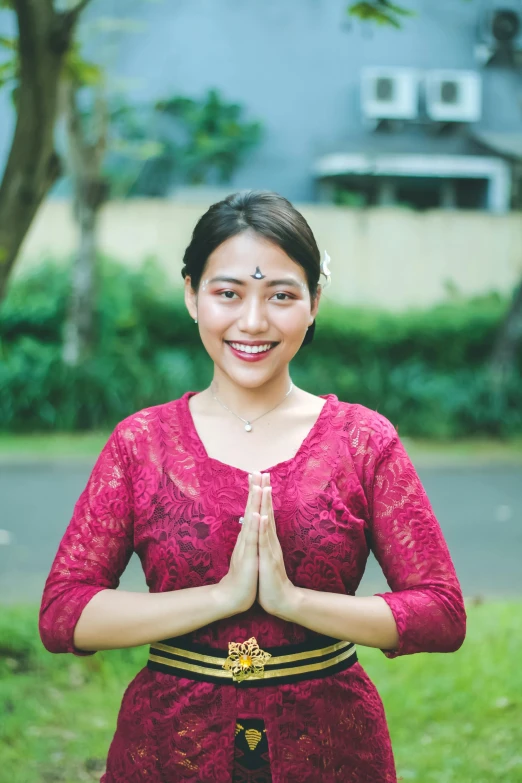 a woman is standing with her arms folded