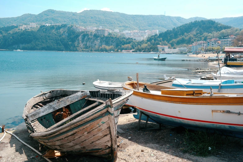 several fishing boats at the shore in a bay