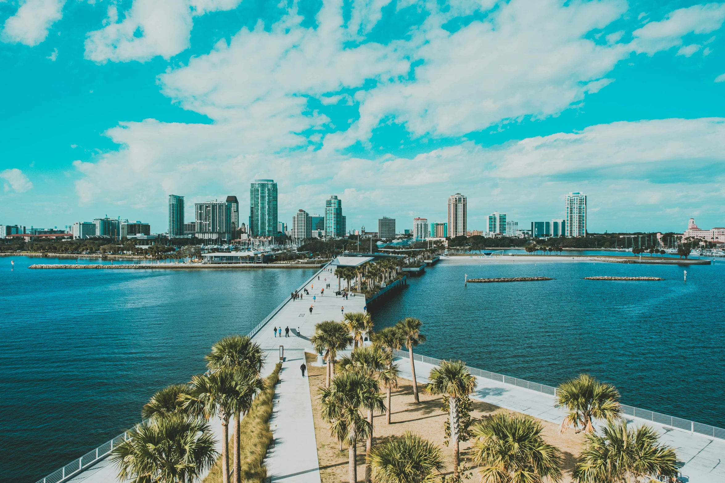 a very wide stretch of waterway with a city in the background