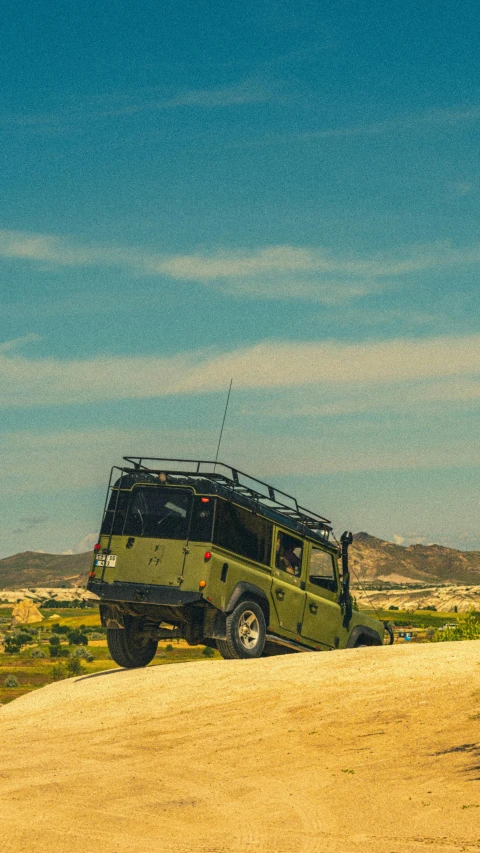 a vehicle is parked on a dirt road