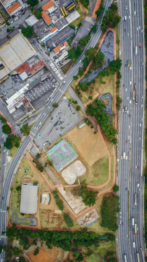 the aerial view of an intersection in a town with lots of traffic