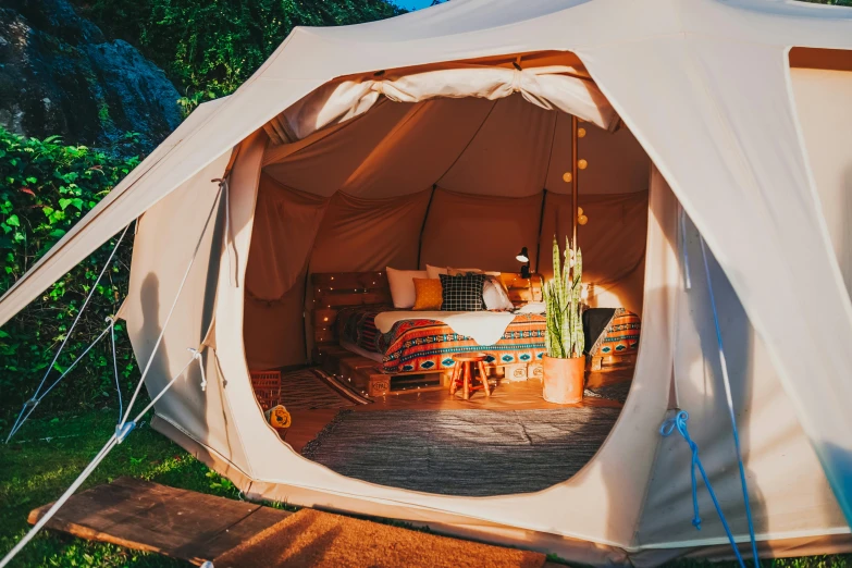 there is an outdoor tent that is on the grass