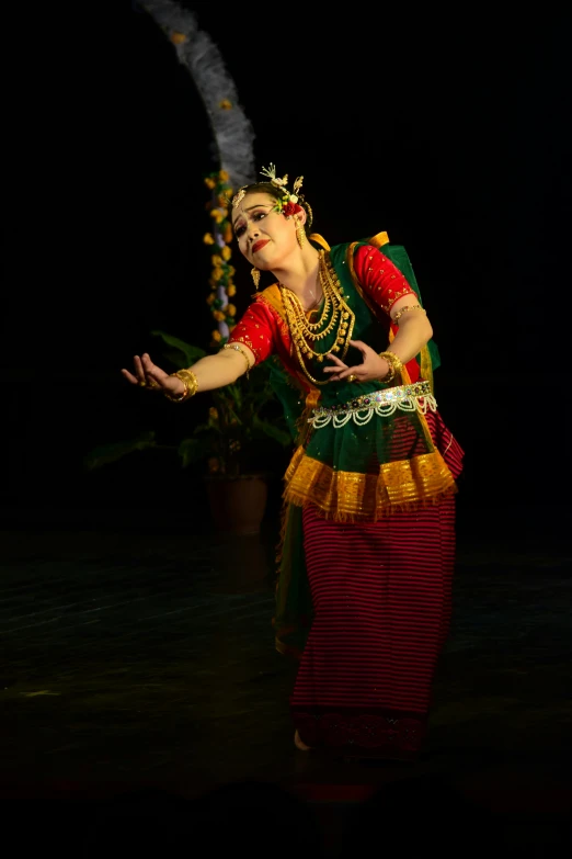 a woman is performing a belly dance on stage