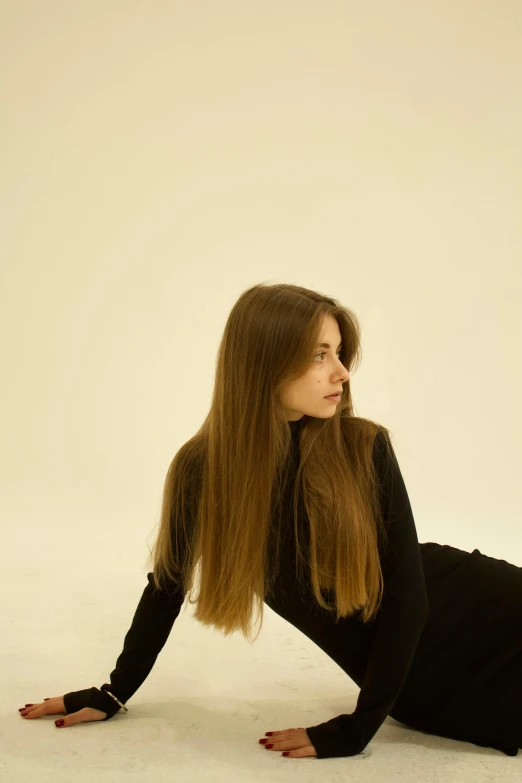 a woman poses for a picture with long hair