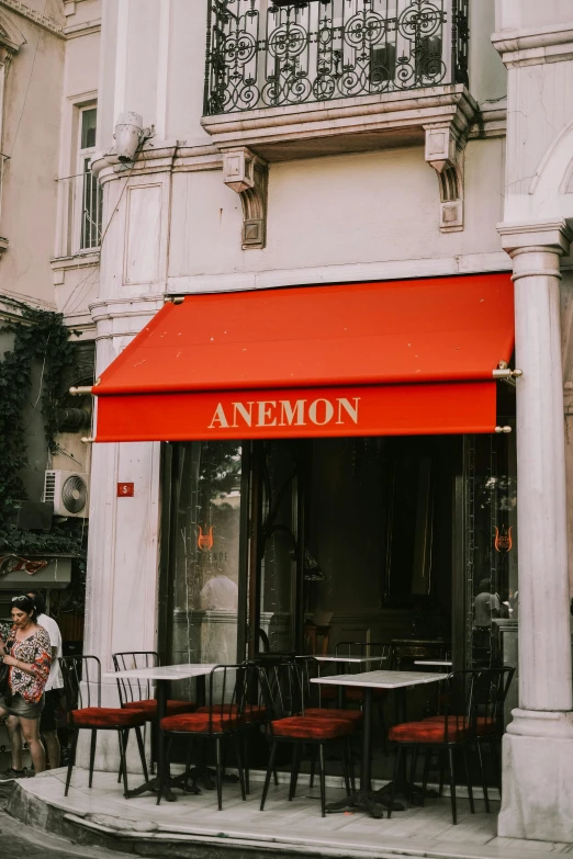 an empty sidewalk outside of an umbrella cafe