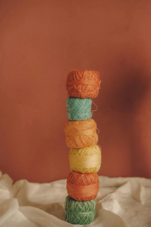 an assortment of yarn with spools in various colors