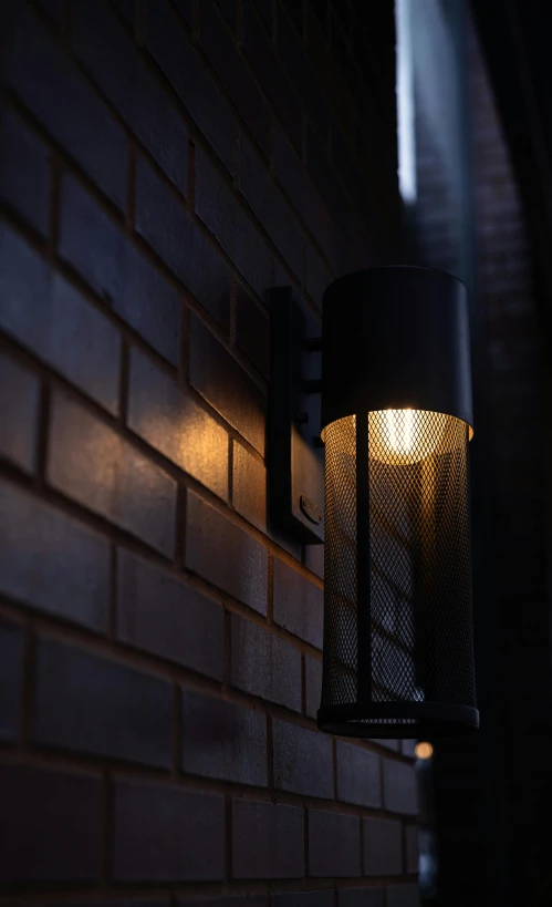 a light is shining on the wall behind a brick