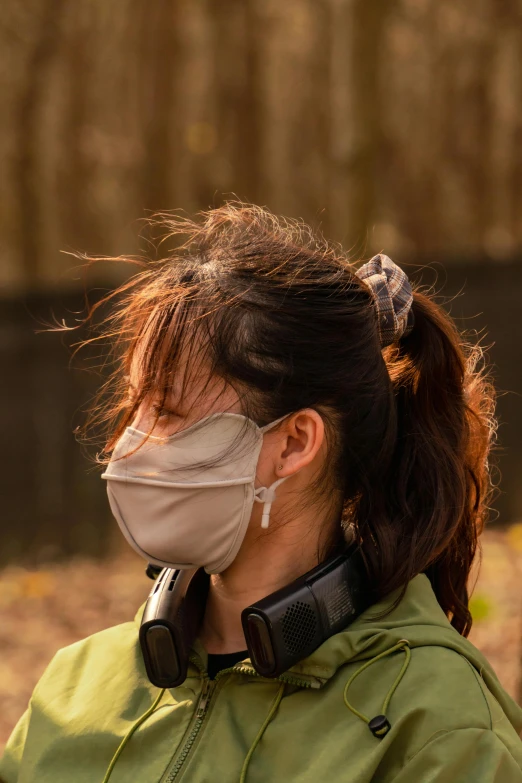 the girl wears a mask to protect herself from the sun