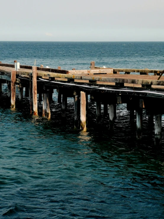 this is a dock over water with a boat