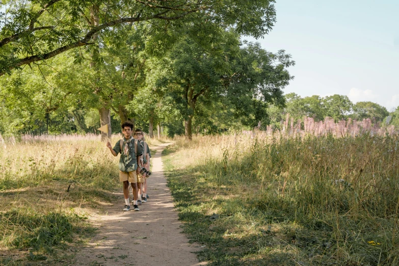 two people are standing on the path outside