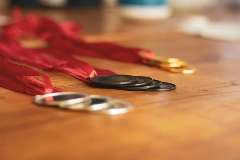 several small ribbons are tied up on the table