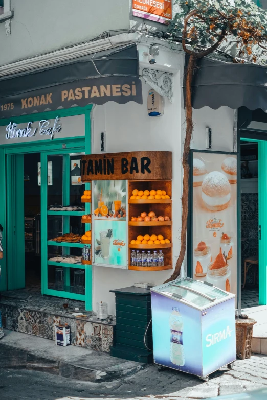 an old restaurant with blue boxes and oranges outside