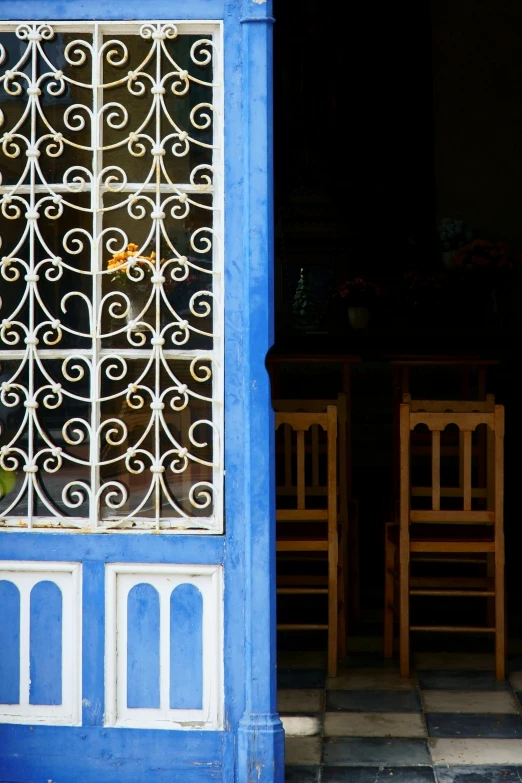 two chairs that are under an outside door