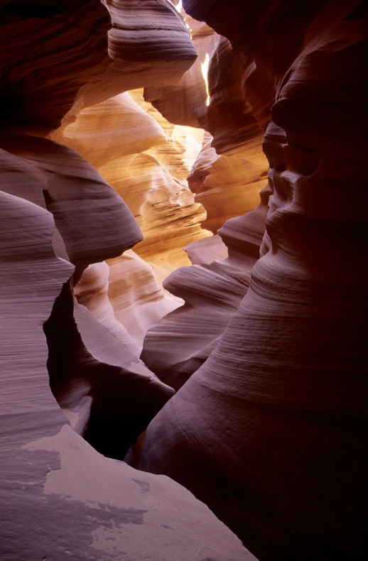 a narrow canyon with lots of water running through it