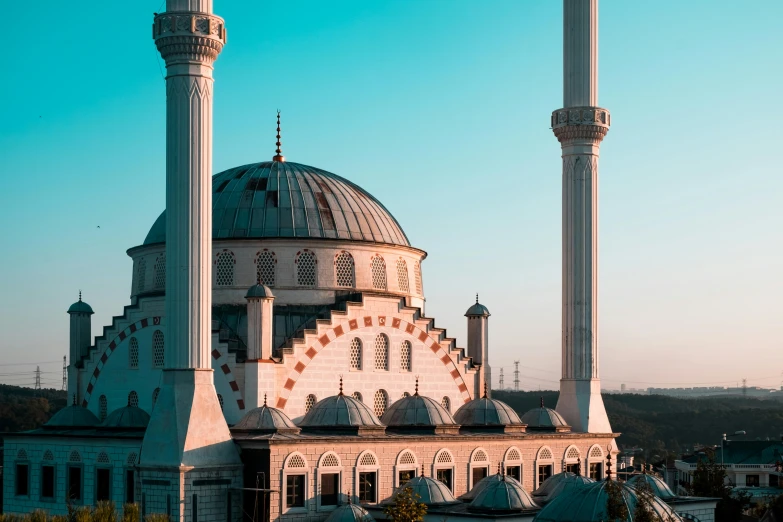 a mosque in a city that has large towers