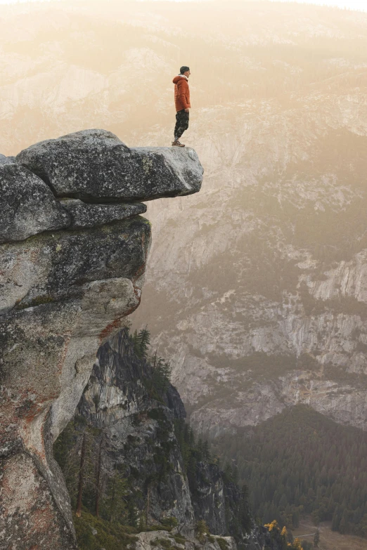 a person standing on top of a mountain with no one