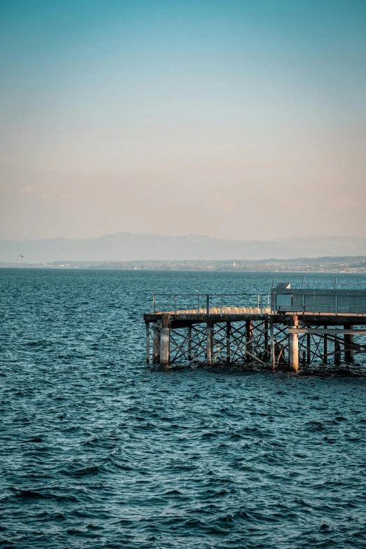 two different types of structure on a pier in the water