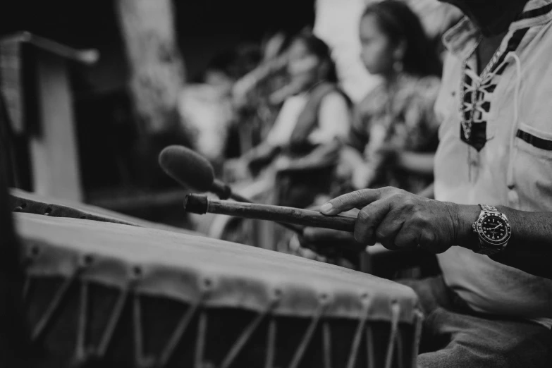 black and white po of an indian woman playing tabola