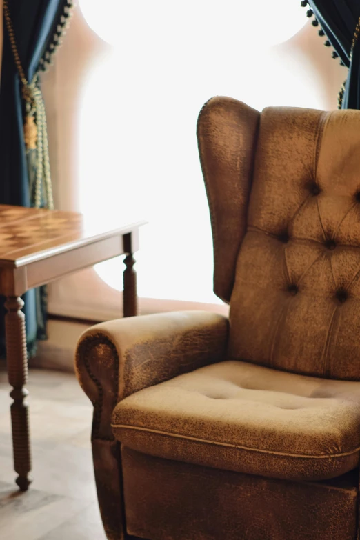 a living room with a chair and table