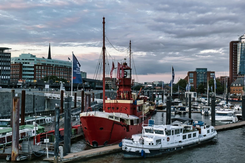 a tugboat in the water is being loaded by another boat