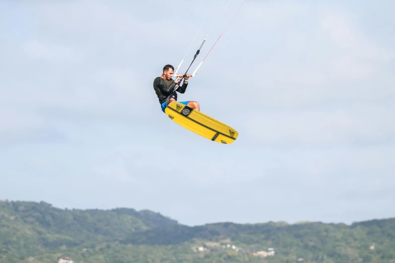 a parasailer is about to launch from the ocean