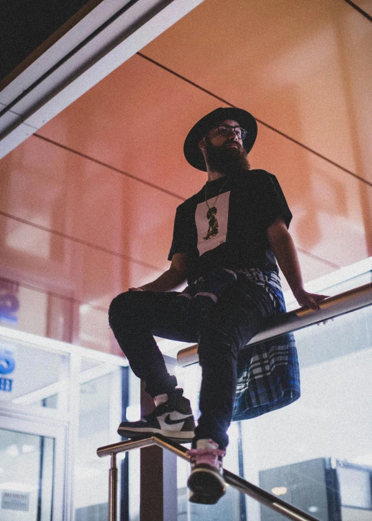 a young person wearing a hat and jeans on a skateboard