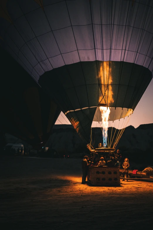 a  air balloon with flame coming out of the pit