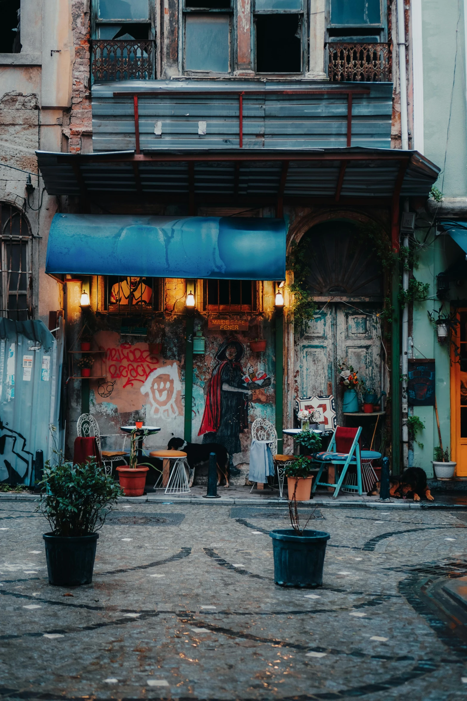 a street scene with a man walking by shop