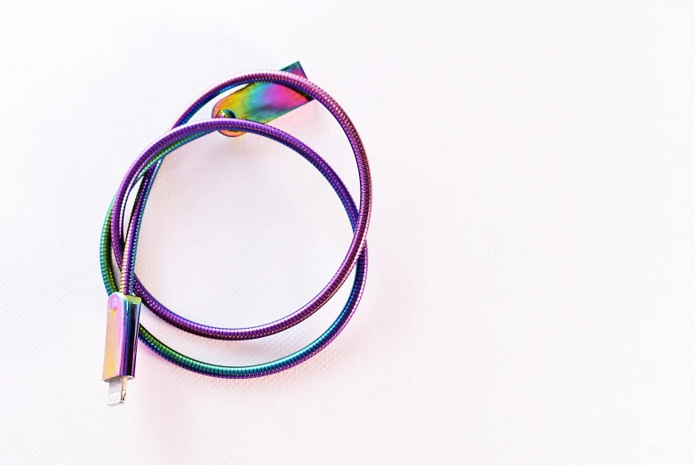 the colorful wires are held on top of each other