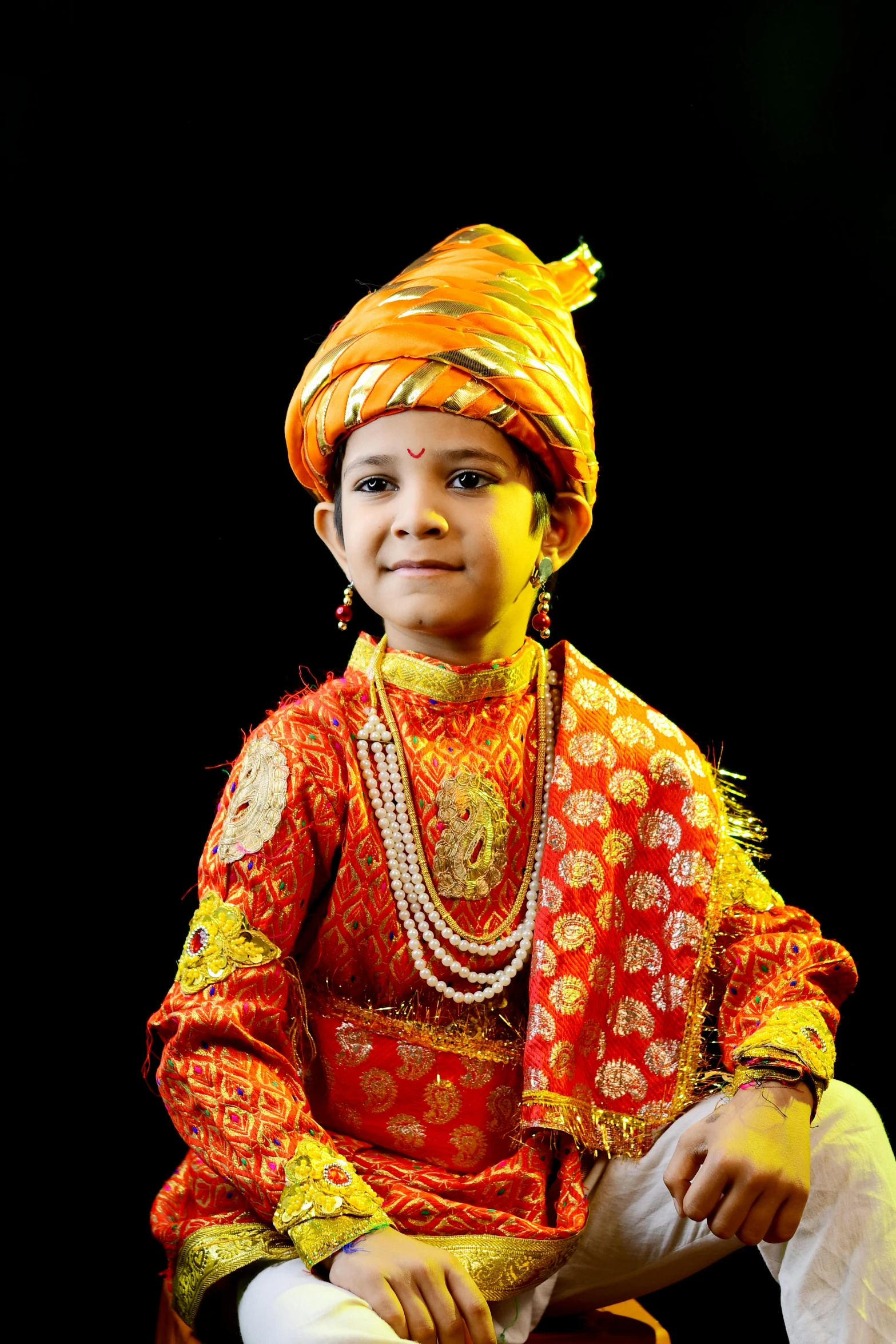 a young person wearing a red and orange outfit