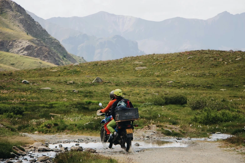 a person riding on a bike through the country